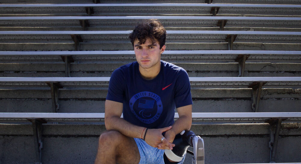 Ezra Frech poses on bleachers
