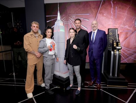 Katie Taylor, Amanda Serrano, Jake Paul pose for a picture at the Empire State Building lighting ceremony