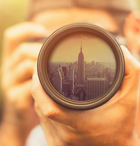 camera pointing at empire state building