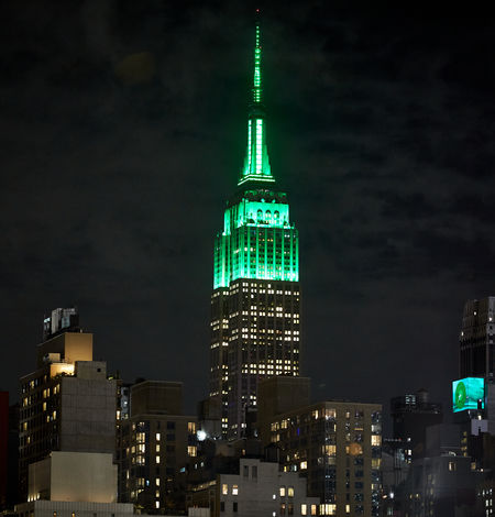 The Empire State Building lit in green