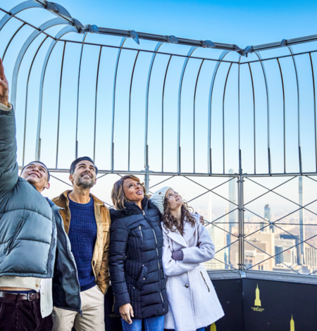 Family on the 86th Floor at the Empire State Building Observatory overlooking view.