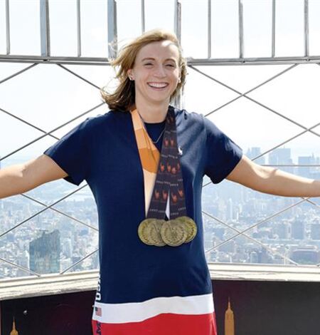 New York City Marathon Winner posing for a photo on the 86th floor observation deck at the Empire State Building Observatory.