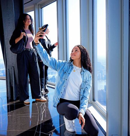 Woman taking a selfie on the 102nd Floor of the Empire State Building Observatory