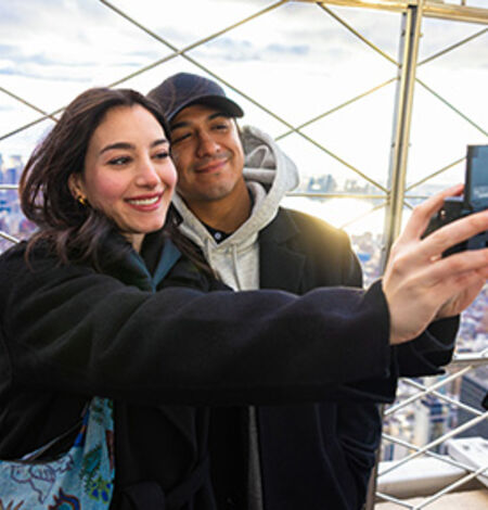 Couple taking a selfie on the 86th Floor Observation Deck of the Empire State Building
