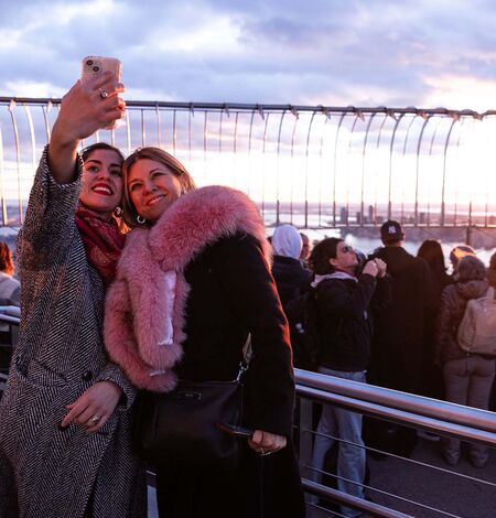 Two women taking selfie on the ESB's 86th NYC Observation Deck