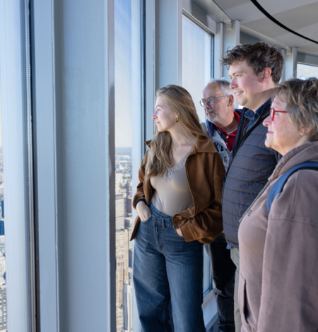 Family looking at the view on the 102nd Floor of the Empire State Building Observatory