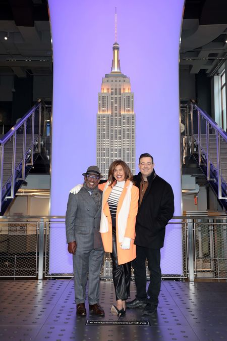 NBC News' TODAY Show hosts Al Green, Hoda Kotb, and Carson Daly, celebrate the 70th Anniversary at The Empire State Building on January 13, 2022 in New York City.