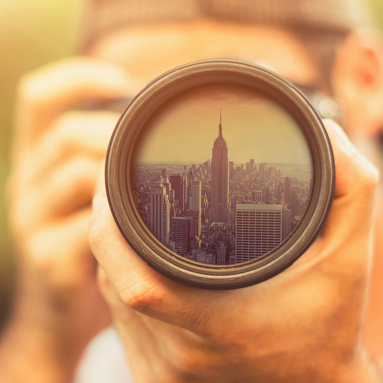 camera pointing at empire state building