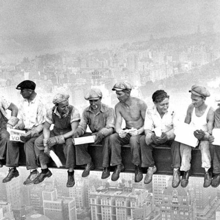 builders sitting on empire statebuilding steel