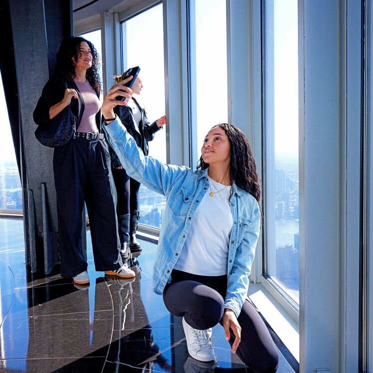 Woman taking a selfie on the 102nd Floor of the Empire State Building Observatory