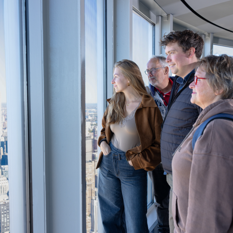 Family looking at the view on the 102nd Floor of the Empire State Building Observatory