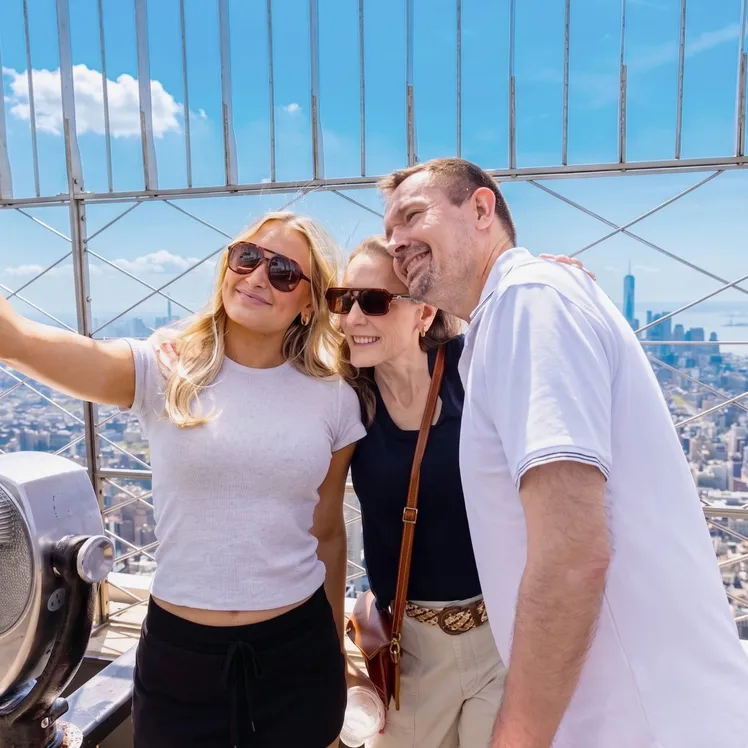Family at the Empire State Building's 86th Floor Observation Deck, Midtown Manhattan's best attraction