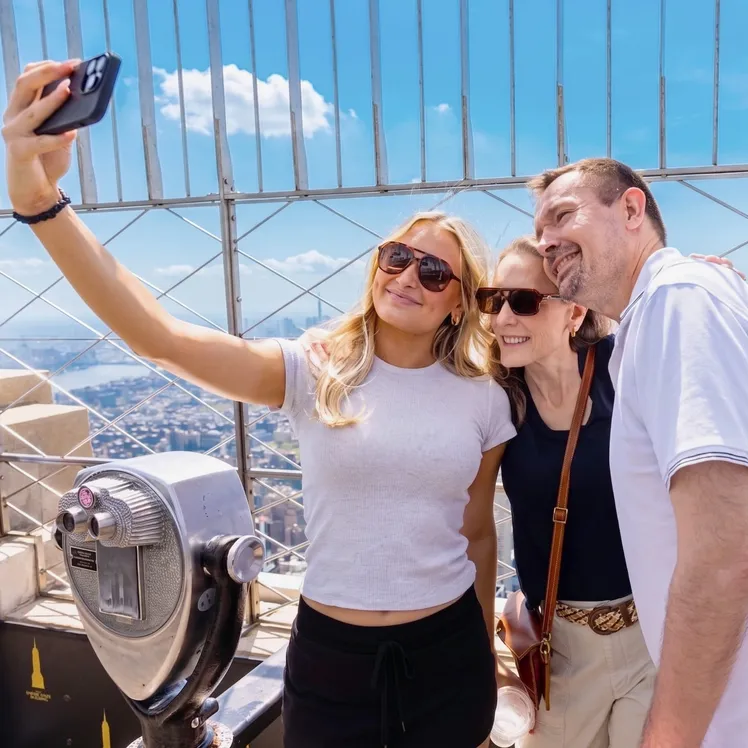 Family at the Empire State Building's 86th Floor Observation Deck, Midtown Manhattan's best attraction