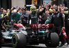 Lewis Hamilton waves to fans after historic stunt
